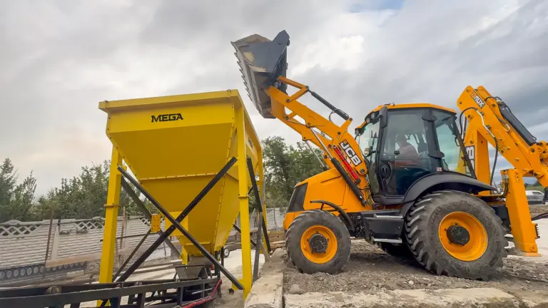 Loader feeding the MEGA aggregate hopper at a customer site in Samtredia, Georgia